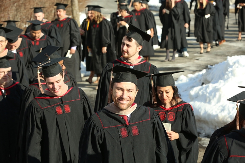 photo of graduates lined up to process